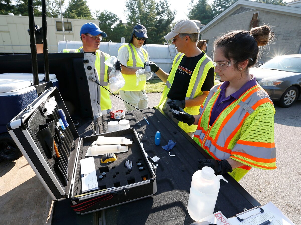 Testing water left to right: Jason Martin, Brian Lee, Jerry Weisenfluh, Abby Monhollen tested creek water as representatives with the city of Lexington and volunteers worked Tuesday morning in the South Elkhorn Creek watershed on Bowman Mill Road. The city is seeking volunteers to help with testing water for West Hickman Creek and is holding a training session next Tuesday, August 21, at 9 a.m. at the Town Branch Water Treatment plant.