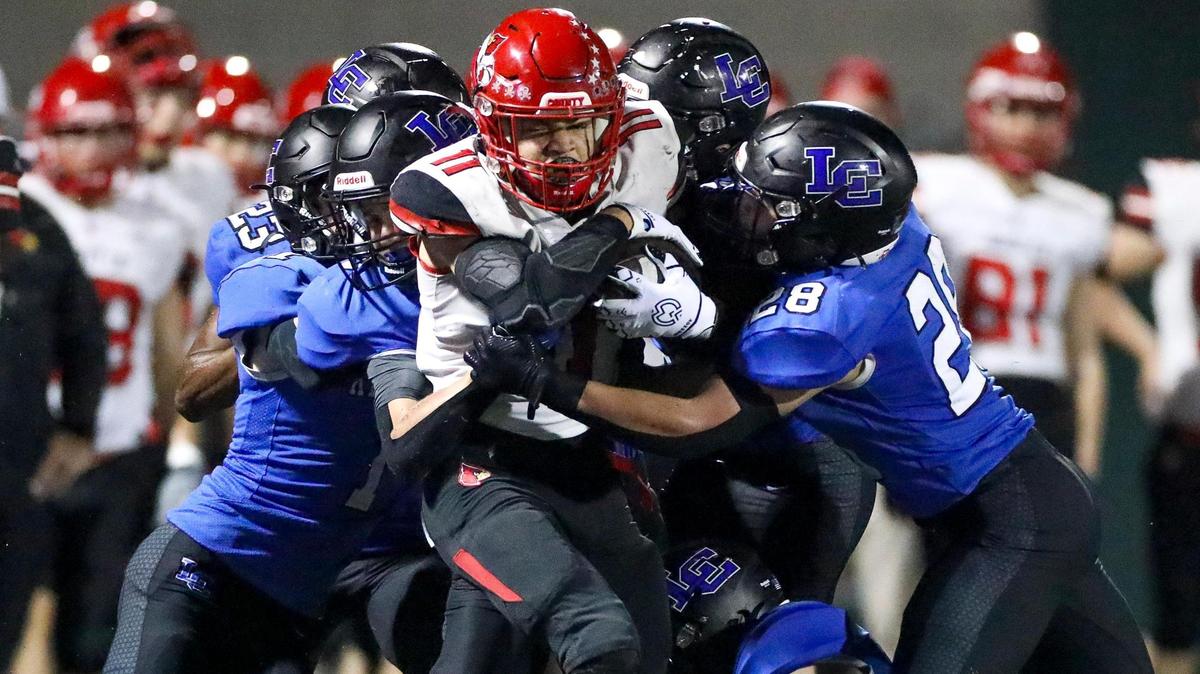 Lexington Catholic swarms Scott County ball carrier Ellis Huguely during Friday night’s win. The Knights’ defense was in the right place at the right time most of the game during its 21-20 Senior Night win over Scott County.