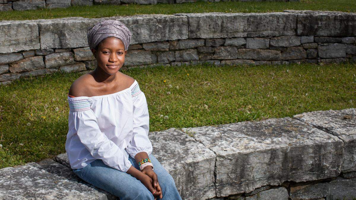 Lordina Mensah poses for a portrait at the Isaac Murphy Memorial Art Garden in Lexington, Ky., Monday, April 19, 2021.
