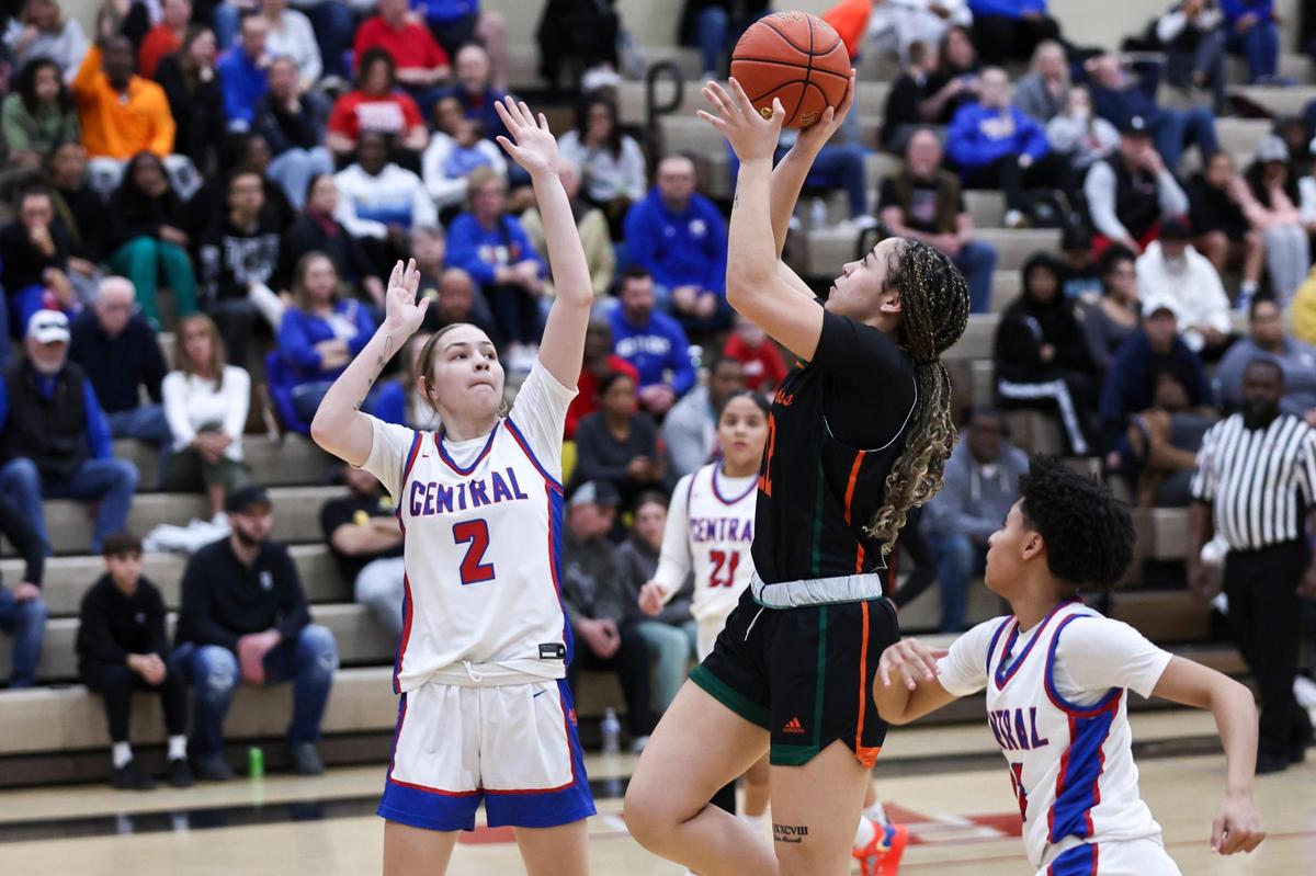 Frederick Douglass’s Amayah Maxwell (12) shoots over Madison Central’s Cameryn Ridderikhoff (2) during the girls 11th Region Tournament semifinals game at Paul Laurence Dunbar High School on Thursday. Maxwell finished with a game-high 20 points.
