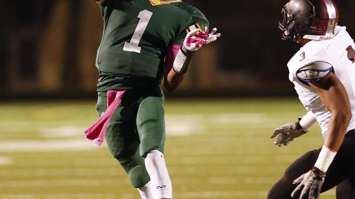 Bryan Station quarterback Ora Johnson,1, threw downfield as Dunbar played Bryan Station on Thursday October 10, 2013 in Lexington, Ky. Photos by Mark Cornelison | Staff