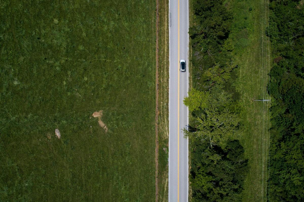 A motorists drives on Union Mill Road in Nicholasville, Friday. To accommodate population growth in Fayette and Jessamine counties, the Kentucky Transportation Cabinet and the Lexington Area Metropolitan Planning Organization have proposed several road expansion plans. One of the proposed plans includes widening Union Mill Road and adding shoulders.