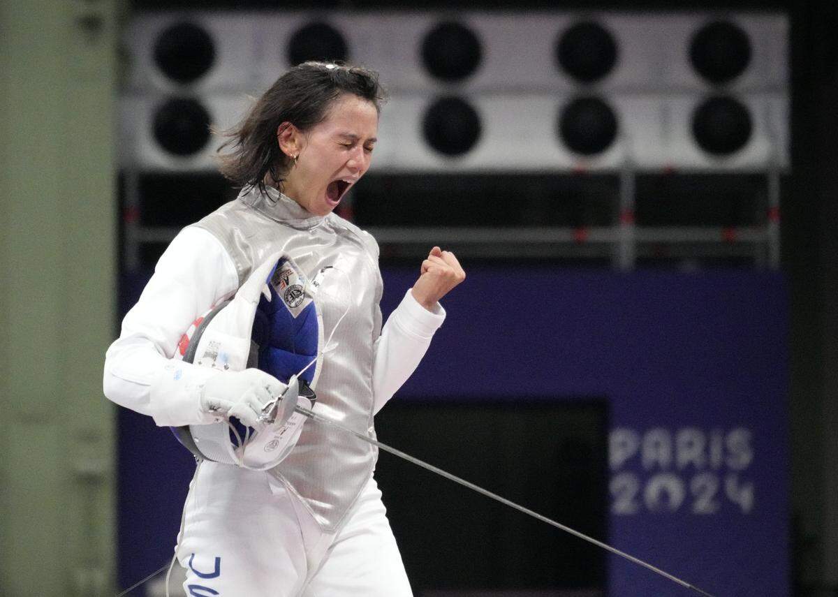 Jul 28, 2024; Paris, France; Lee Kiefer (USA) celebrates defeating Martyna Jelinska (POL) in a women's foil individual table of 32 match during the Paris 2024 Olympic Summer Games at Grand Palais. Mandatory Credit: Andrew P. Scott-USA TODAY Sports