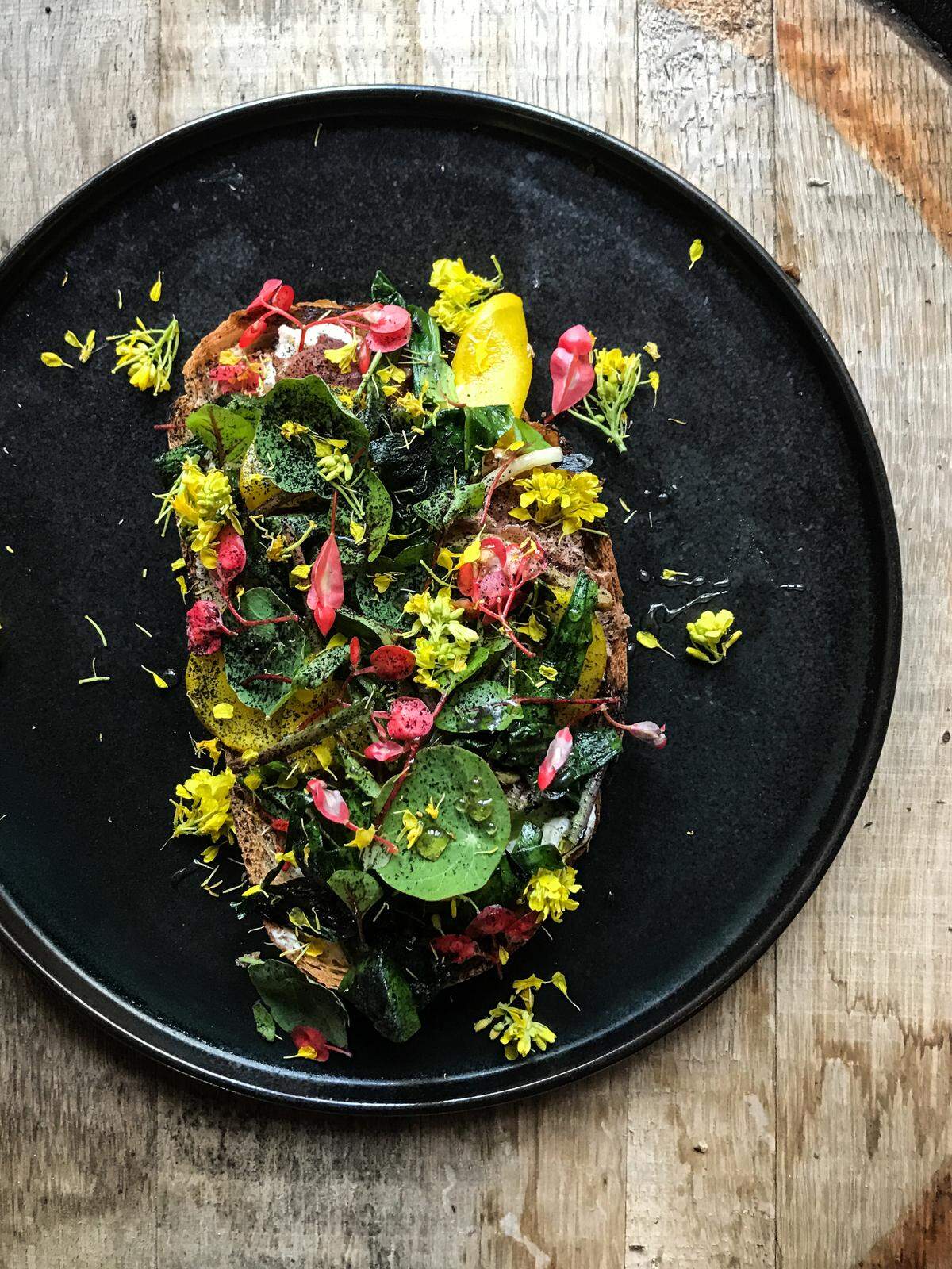 Tartine at Bourbon Steak features fresh seasonal vegetables, herbs and ingredients on top of the Tartine.