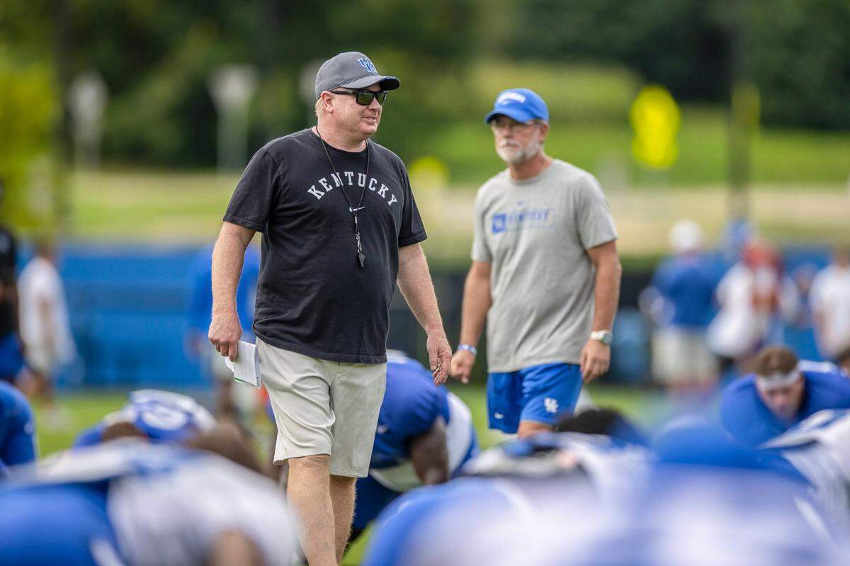 Mark Stoops participated in Saturday’s football Fan Day and open practice at UK’s Joe Craft Training Facility. The Kentucky head coach said that there’s still a lot to be done before the Sept. 3 season opener. “There’s certain areas, certain question marks on this team where we’ve got to work hard, get those answers fixed.”