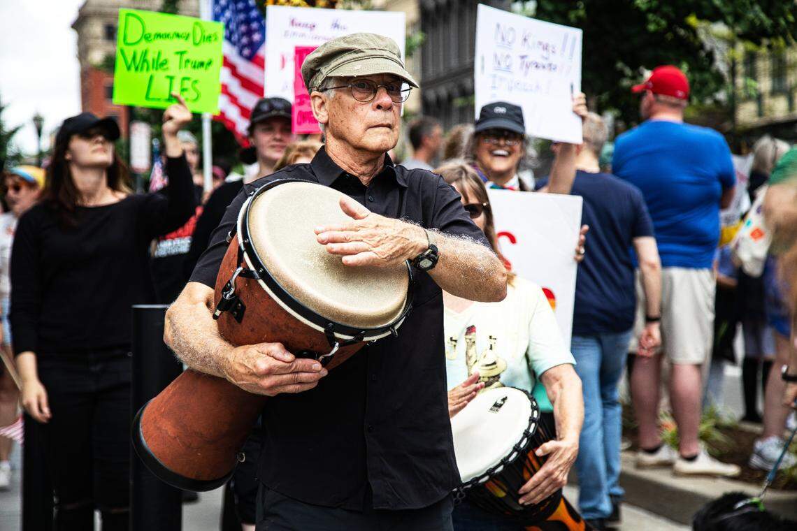 Drummers matched and sang songs of protest, joining in on the “No Kings” protest of President Donald Trump’s administration on Saturday, June 14, 2025, in downtown Lexington, Ky.