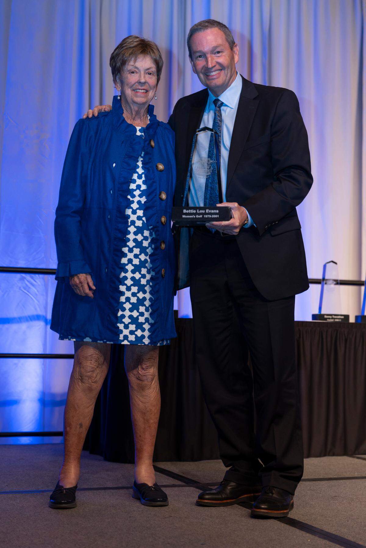 Former University of Kentucky golf coach Bettie Lou Evans with UK athletics director Mitch Barnhart at the UK Athletics Hall of Fame inductions in 2021.