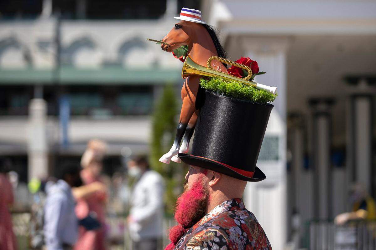 Garey Faulkner, of Cincinnati, Ohio, shows off his hat on Derby Day at Churchill Downs in Louisville, Ky., on Saturday, May 1, 2021.