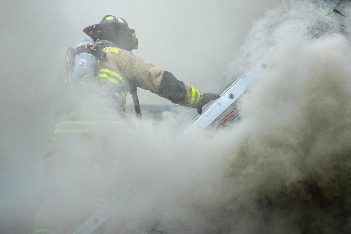 Members of the Lexington Fire Department respond to a structure fire on Aylesford Place in Lexington, Ky., on Monday, June 20, 2022.