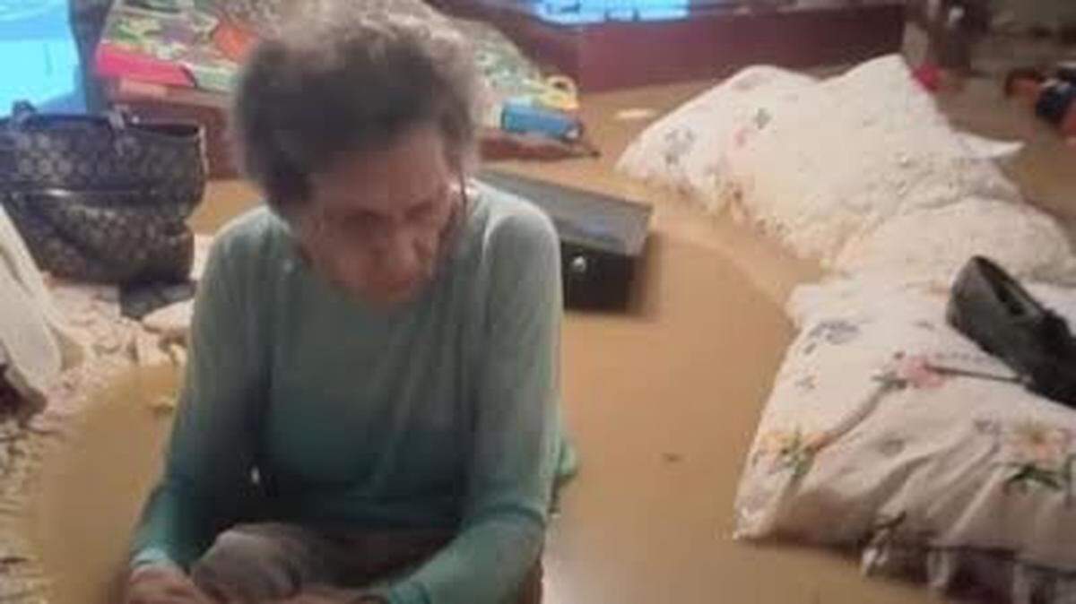 Photo of Ky. woman, 97, trapped inside flooded home goes viral. She swam to rescuers