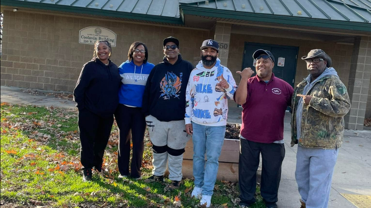 Quaynell King, third from right, is being remembered as a loving father and dedicated community organizer and leader. King, 44, died in a shooting on Versailles Road in Lexington on Sunday night, December 1, 2024.