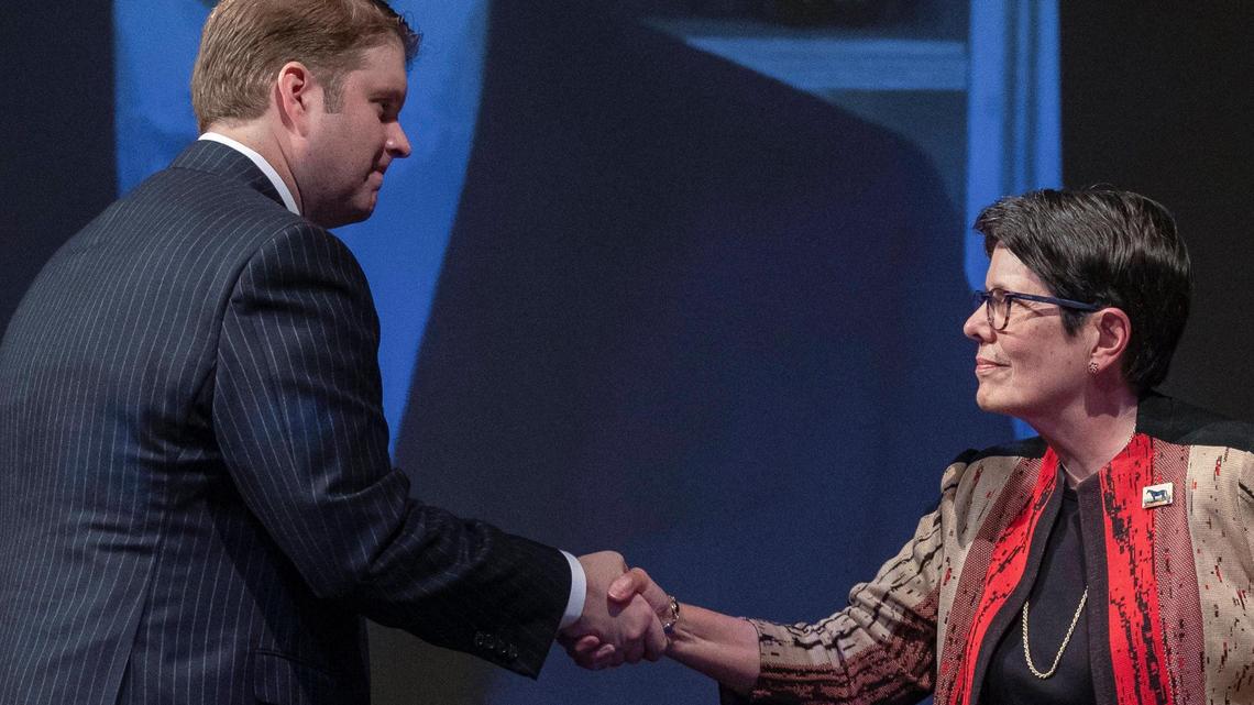 Lexington mayoral candidates David Kloiber, left and Linda Gorton, current mayor, shake hands following a candidate forum at the Lyric Theatre and Cultural Arts Center in Lexington, Ky., on Wednesday, Sept. 14, 2022.