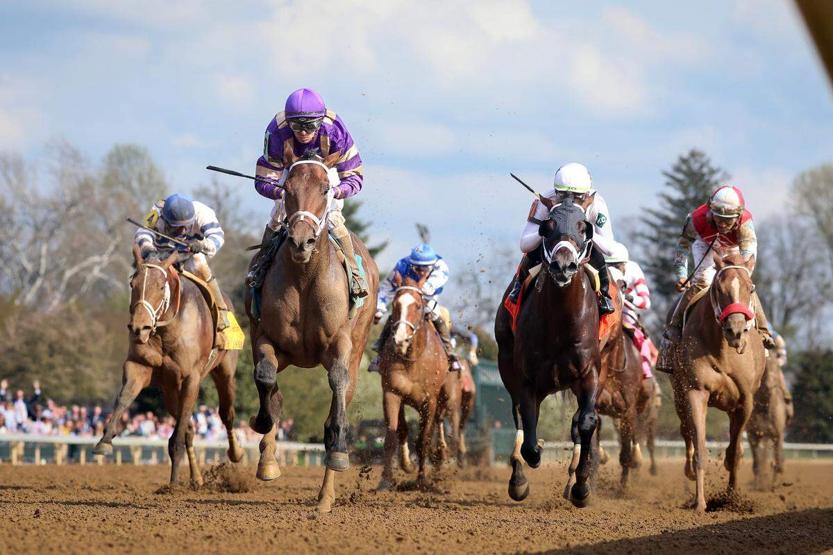 Tawny Port, second from left with Florent Geroux up, wins the Stonestreet Lexington for trainer Brad Cox and owner John Fort on Saturday at Keeneland.
