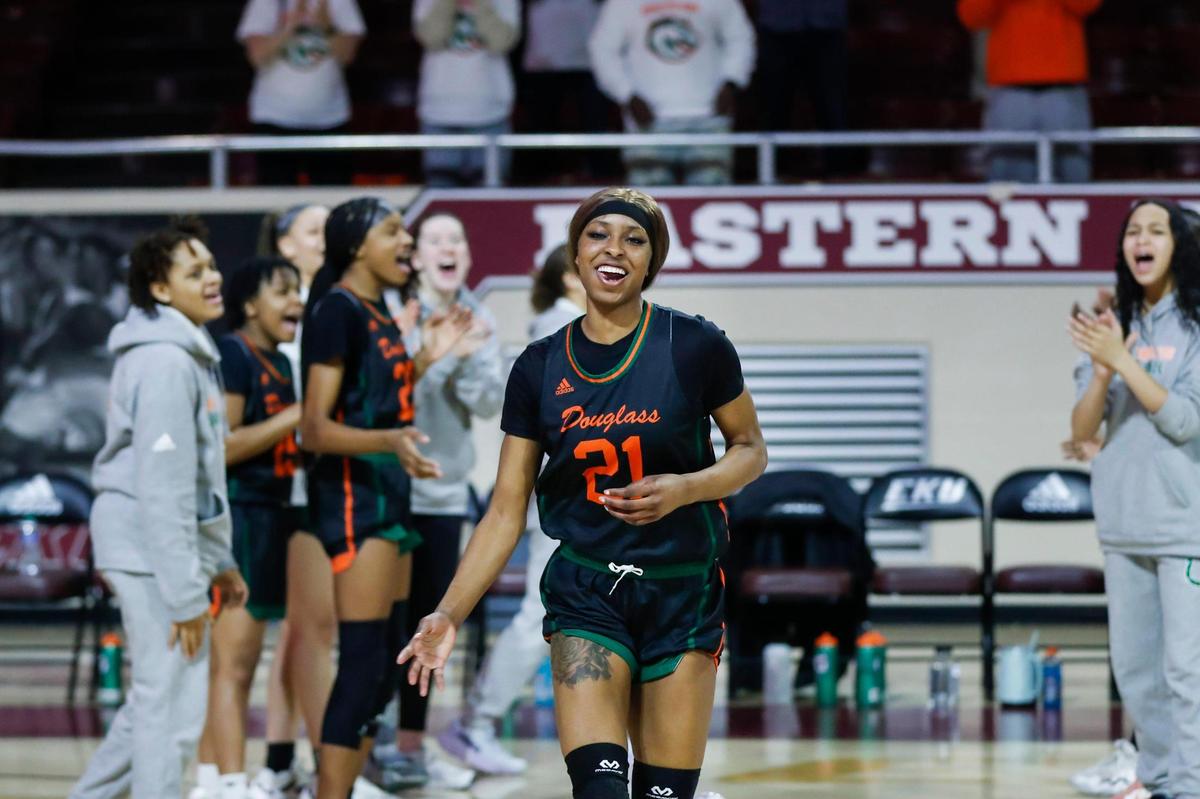 Frederick Douglass’ Ayanna-Sarai Darrington smiles during player introductions before the 11th Region Tournament championship game at Eastern Kentucky University’s Baptist Health Arena in Richmond on March 4.