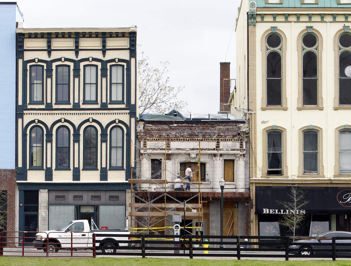 The two-story building’s terra cotta facade was uncovered and restored in 2011 before the Trust lounge opened that year. The building was originally the Phoenix Bank.