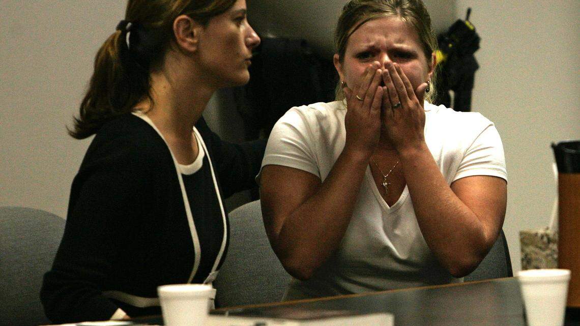 Stephanie Olson, right, with Amber Browning of her defense team at her side, hears Judge Paul F. Isaacs read the guilty verdict reached by the jury in the murder trial of her mother Diane Snellen in Georgetown Ky on Friday May 27, 2005. Mark Cornelison/ Staff