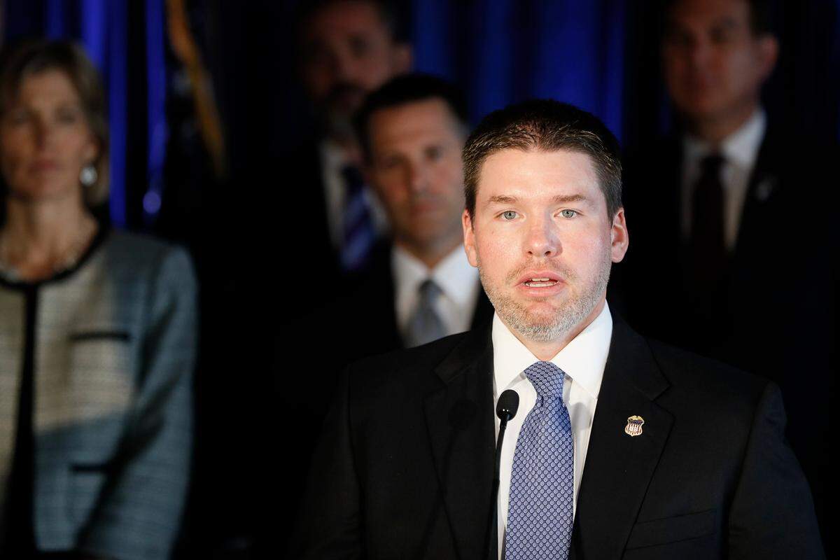 Robert Duncan Jr., U.S. Attorney for the Eastern District of Kentucky, speaks beside members of Appalachian Regional Prescription Opioid Strike Force, during a news conference, Wednesday, April 17, 2019, in Cincinnati. Federal authorities have charged 60 people, including 31 doctors, for their roles in illegal prescribing and distributing millions of pills with opioids and other dangerous drugs. (AP Photo/John Minchillo)