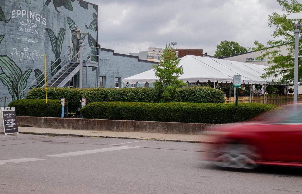 The tent at Epping’s on Eastside has picnic tables six feet apart for customer safety.