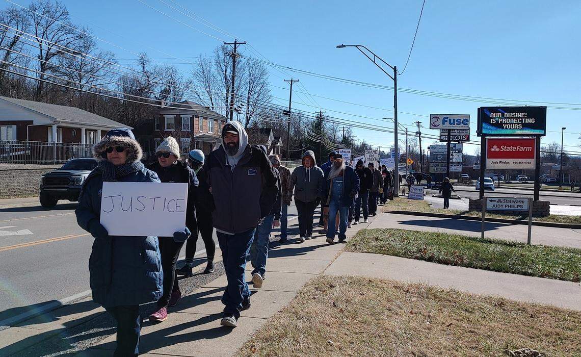 Protesters march to a parking lot across from the London Police Department in Laurel County, Ky., Saturday, Jan. 4, 2025, to call attention to the death of Douglas Harless. Harless died after being shot at his home by police who apparently had intended to go to a different address nearby to execute a search warrant.