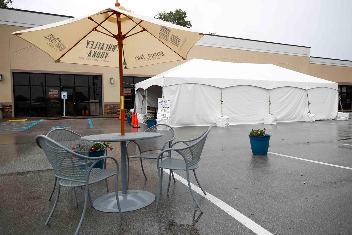 A table and a 20x40 foot tent sit in the parking lot Tuesday at Ramsey’s Diner on Zandale Drive. Ramsey’s will only open their Zandale location then stagger their other three locations.