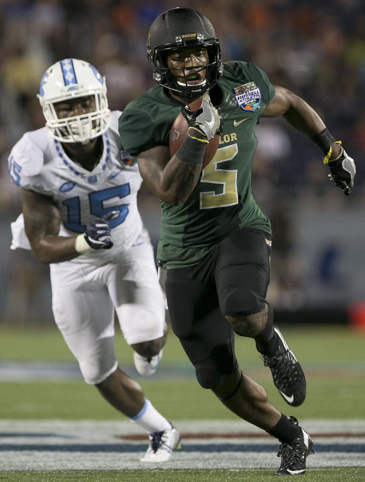 Baylor’s Johnny Jefferson (5) ran for 299 yards and three touchdowns as the shorthanded Bears upset No. 10 North Carolina 49-38 in the 2015 Russell Athletic Bowl.