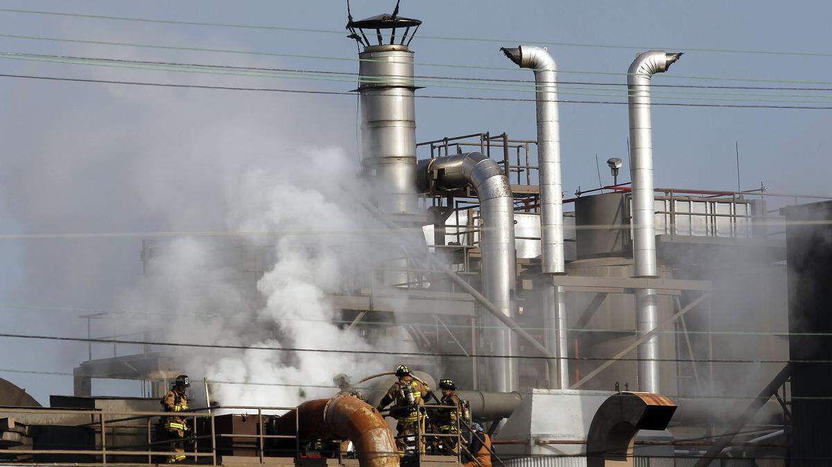 A huge column of smoke formed at the J.M. Smucker Co. plant on Winchester Road after one of the peanut roasters caught fire. 