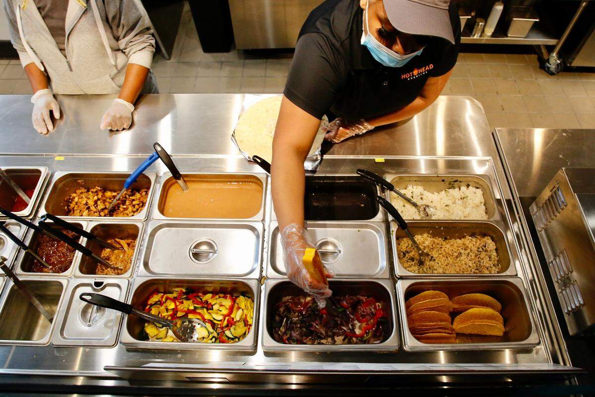 Ingredients such as rice, black beans, pinto beans, peppers and onions, chicken, steak, pork spicy pork, taco meat and fish can be created into bowls, burritos and tacos at Hot Head Burritos new Lexington location off Newtown Pike.