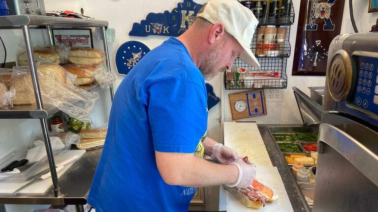 UK-themed deli renames sandwiches, gets visit from new coach. Ready for a Popes Pastrami?