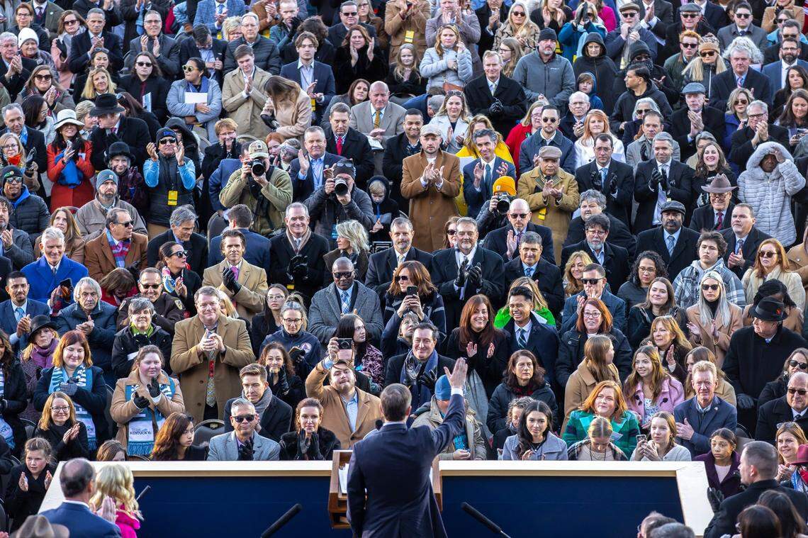 Kentucky Gov. Andy Beshear waves to the crowd before taking the oath of office outside the state Capitol in Frankfort, Ky., on Tuesday, Dec. 12, 2023.
