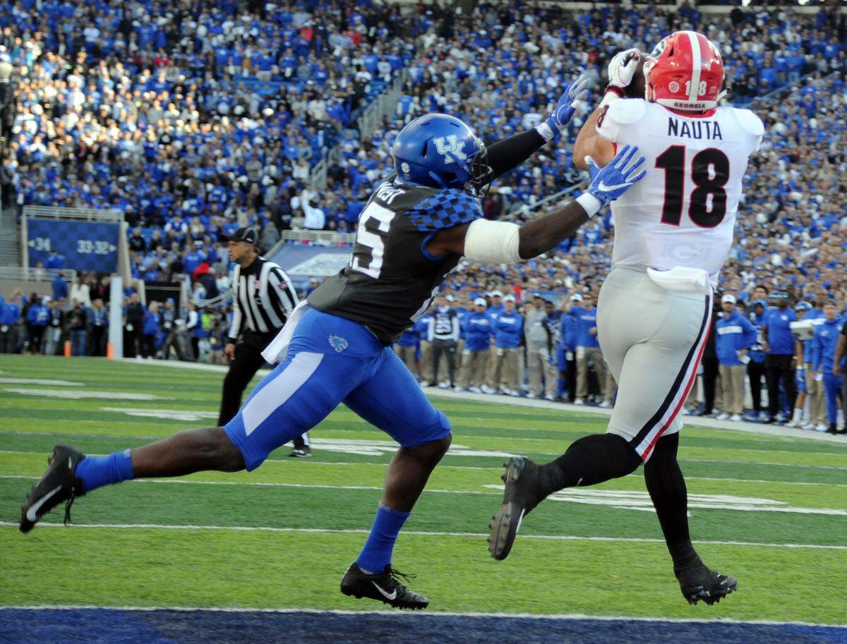 Georgia tight end Isaac Nauta hauled in a touchdown while defended by Kentucky safety Darius West during the first quarter of the Bulldogs' 34-17 win over UK in 2018. Riding on the outcome of the game was the SEC East championship.
