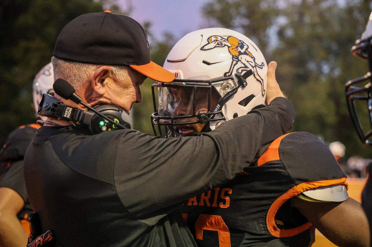Paris head coach Dane Damron congratulates Brandon Smith-Santiago after a touchdown in the second quarter against Williamsburg.