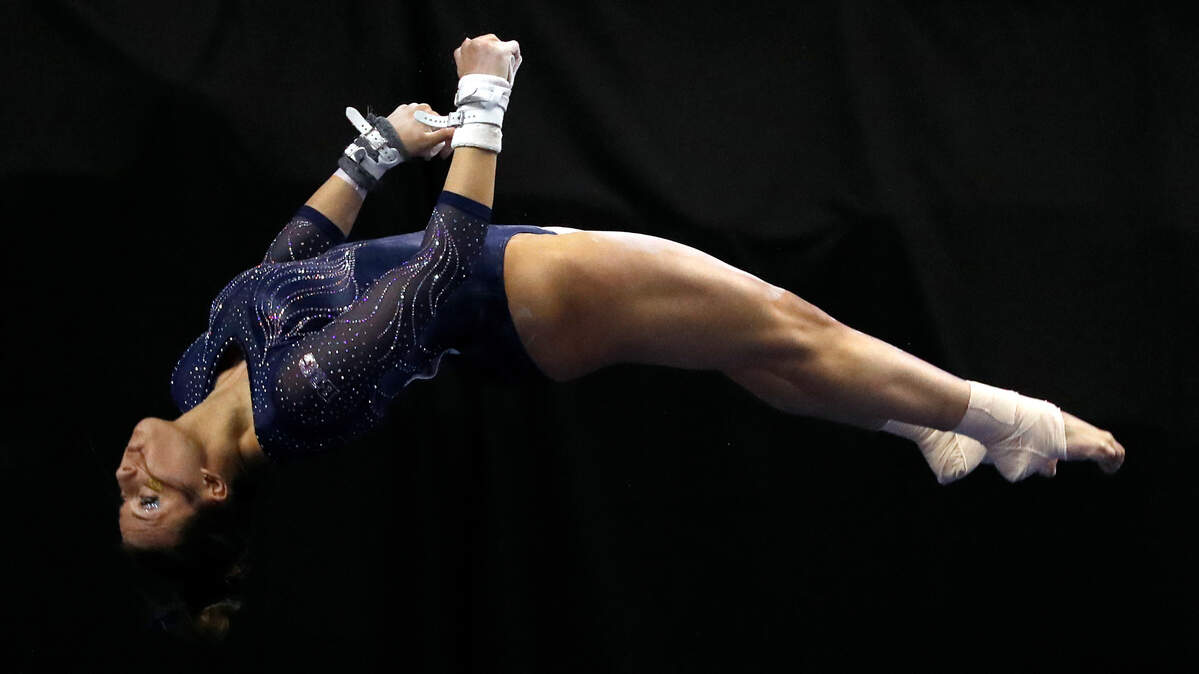Michigan’s Olivia Karas dismounted during an uneven parallel bars routine during the NCAA women’s gymnastics championships on April 14, 2017, in St. Louis.