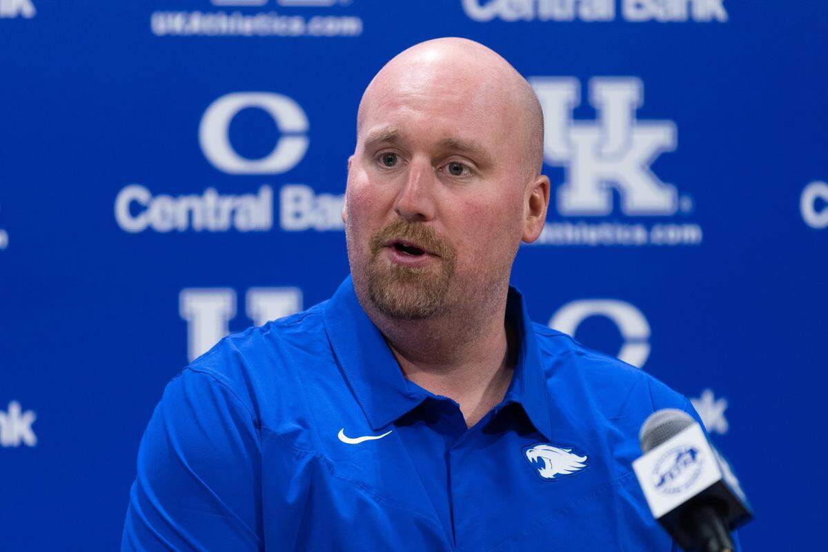 New Kentucky football offensive line coach Zach Yenser speaks to media during a press conference at Kroger Field on March 1.