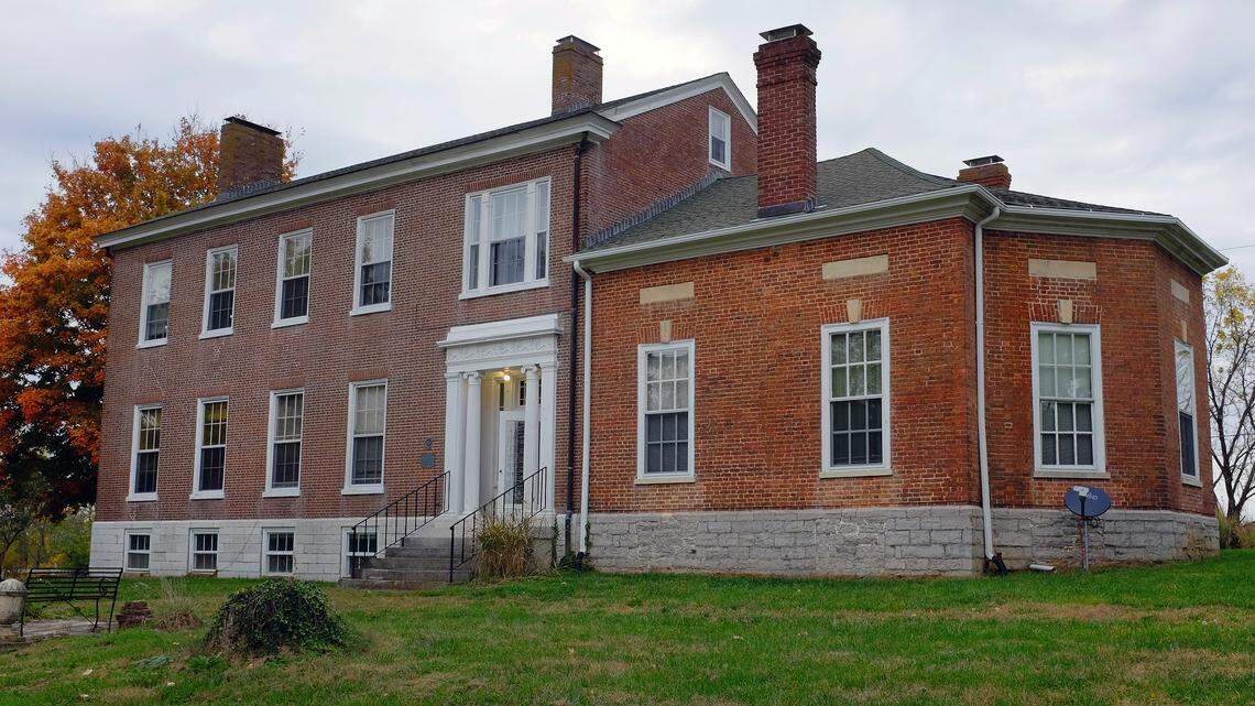David Meade built the octagonal parlor,at right, about 1823. The rest of his house was a collection of log cabins, now long gone. The Greek Revival house, left, was built in 1840 by a different owner.