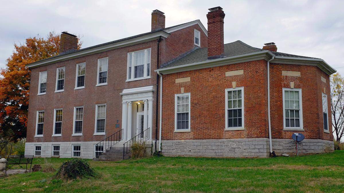 David Meade built the octagonal parlor,at right, about 1823. The rest of his house was a collection of log cabins, now long gone. The Greek Revival house, left, was built in 1840 by a different owner.
