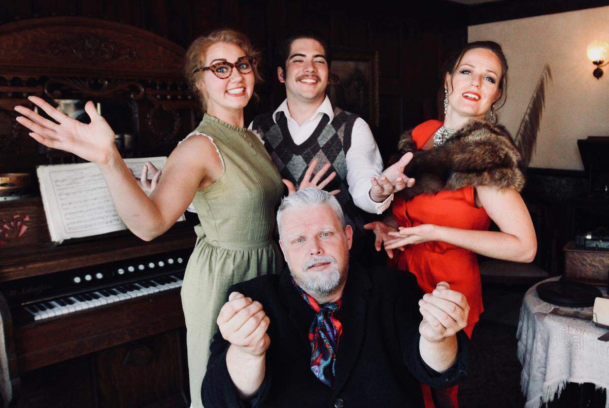 Fannie LeMasters, Giancarlo Herrera, and Erika Lee Sengstack (standing, left to right), and Eric Seale (seated), star in ‘Living on Love’  at Pioneer Playhouse.