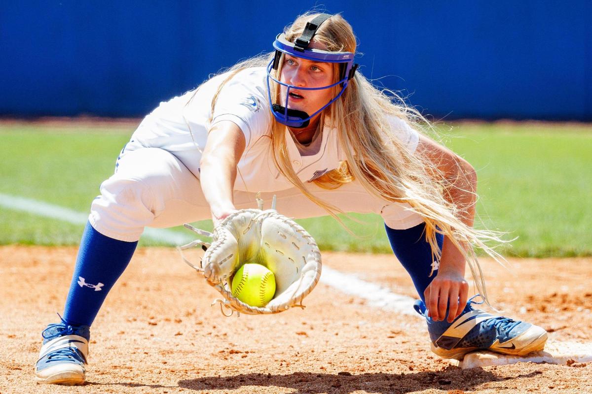 Lexington Catholic’s Lydia Kennedy catches the ball for an out at first against McCracken County during the state softball semifinals Saturday.