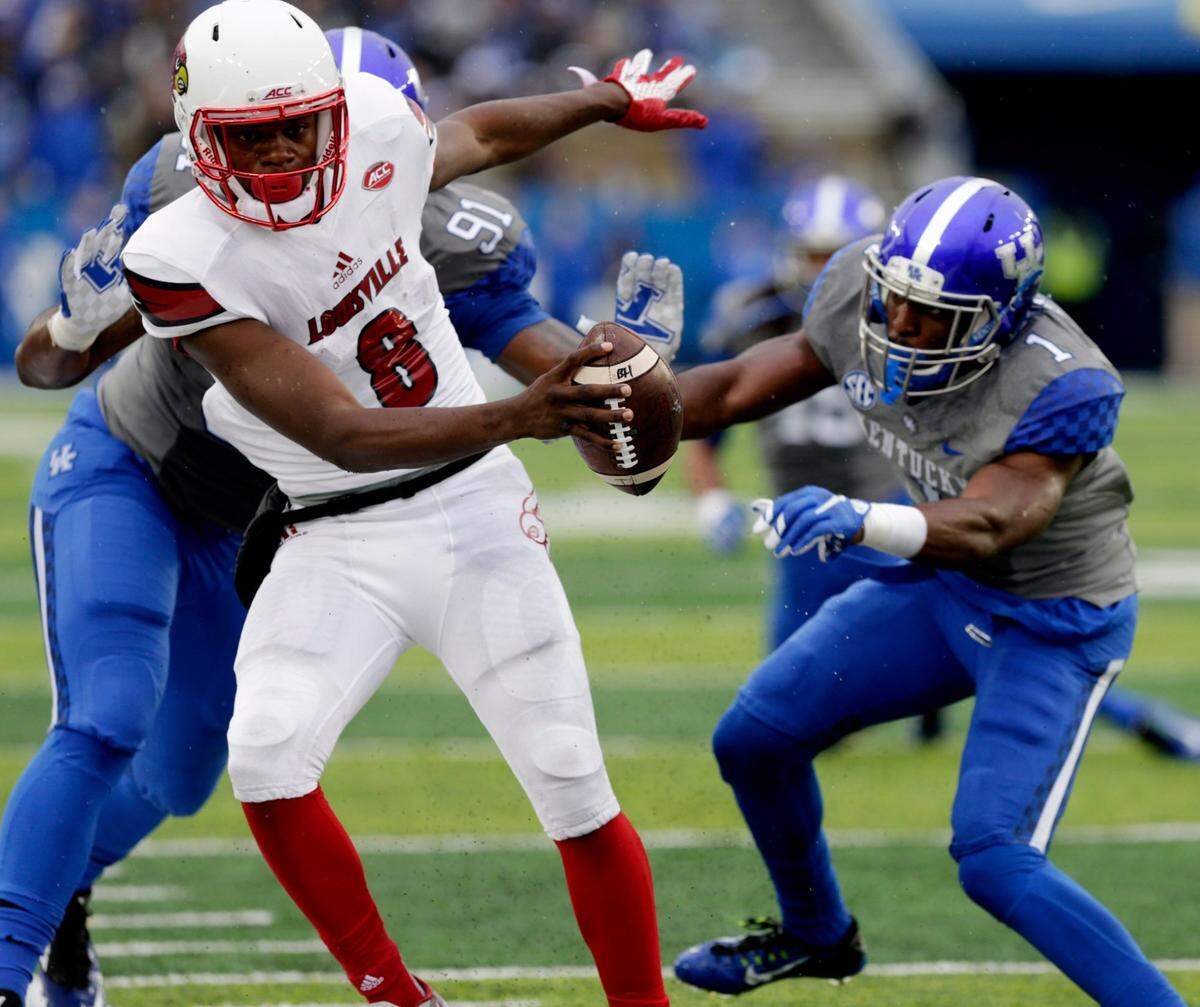 Louisville true freshman quarterback Lamar Jackson (8) came off the bench to rally the Cardinals from a 21-0 deficit to a 38-24 victory over Kentucky in the 2015 renewal of the Governor’s Cup rivalry.