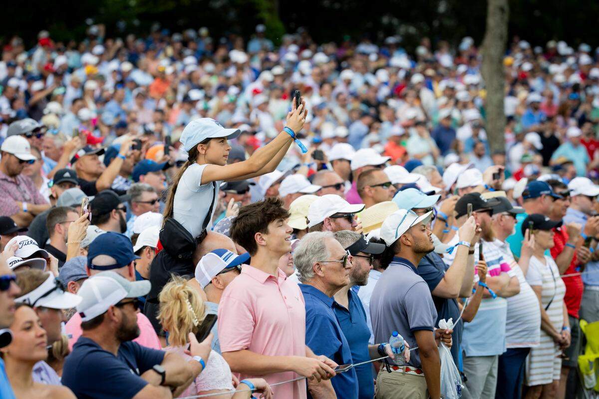 Fans try to catch a glimpse of Tiger Woods during the first round of the PGA Championship at Valhalla Golf Course in Louisville on Thursday. “I think that I appreciate it more now,” Woods said of the crowds following him&nbsp; this week. “Just the fact that I don’t come out here very often."