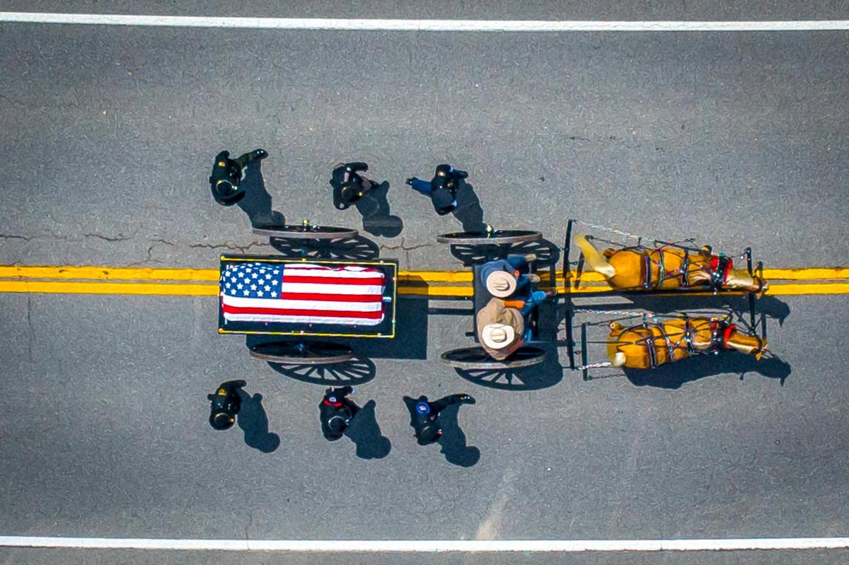 The coffin carrying Jacob Chaffins is brought to Gethsemane Gardens in Prestonsburg, Ky., on Thursday, July 7, 2022. Chaffins, a Prestonsburg police officer, was killed in the line of duty in July. His service concluded a three-day long stretch of funerals honoring the fallen officers killed during a violent ambush in Floyd County. Lance Storz allegedly opened fire on Floyd County sheriff’s deputies attempting to serve an emergency protective order, according to local officials.