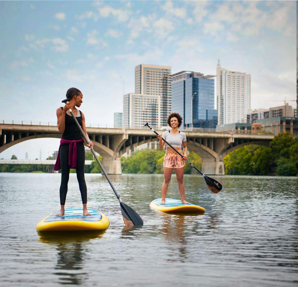 Paddleboarding on Lady Bird Lake is a popular amusement in Austin, Texas.