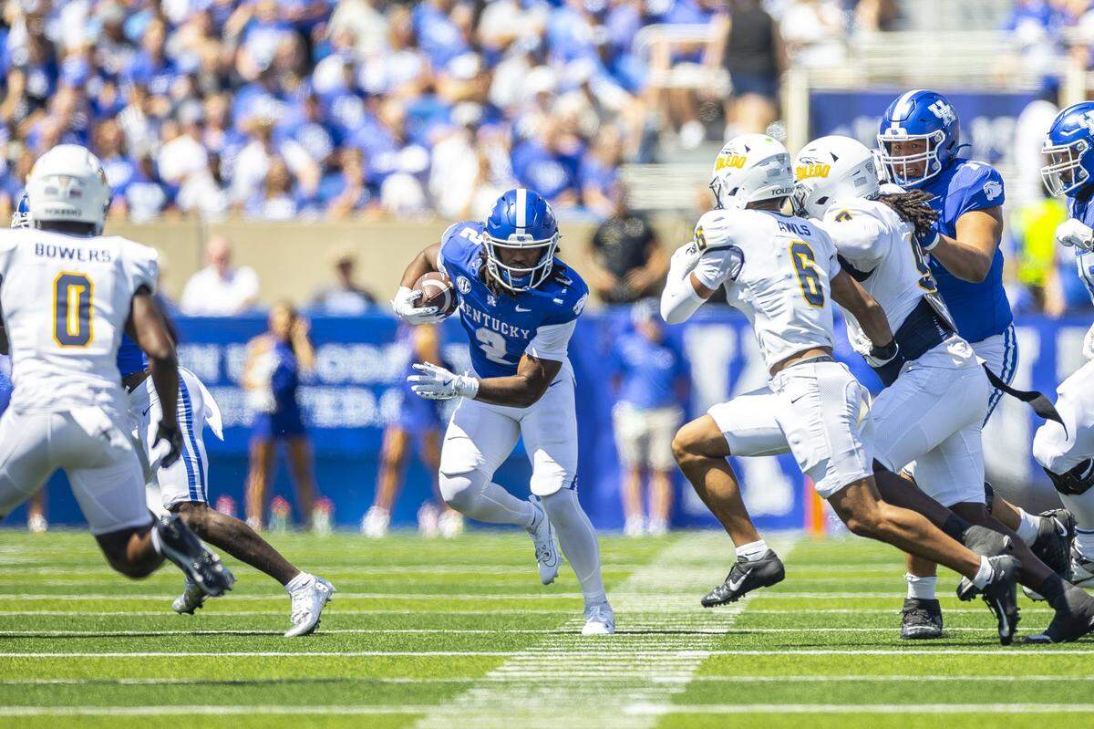 Kentucky Wildcats running back Dante Dowdell (2) runs the ball during a game Toledo Rockets at Kroger Field in Lexington, Ky., on Saturday, Aug. 30, 2025. 