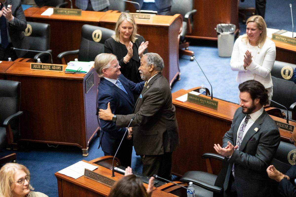 Minority Floor Leader Sen. Gerald A. Neal shakes hands with Majority Floor Leader Sen. Damon Thayer during the opening day of the 2023 legislative session for the Kentucky General Assembly at the Capitol in Frankfort, Ky., Tuesday, January 3, 2023.