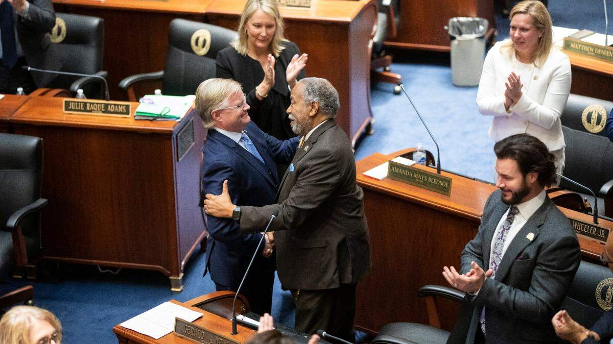 Minority Floor Leader Sen. Gerald Neal shakes hands with Majority Floor Leader Sen. Damon Thayer during the opening day of the 2023 legislative session for the Kentucky General Assembly at the Capitol in Frankfort, Ky., Jan. 3, 2023.