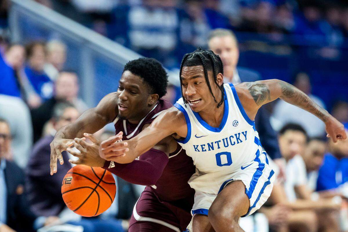 Kentucky guard Rob Dillingham (0) tries to steal the ball against Mississippi State during Wednesday’s game at Rupp Arena.
