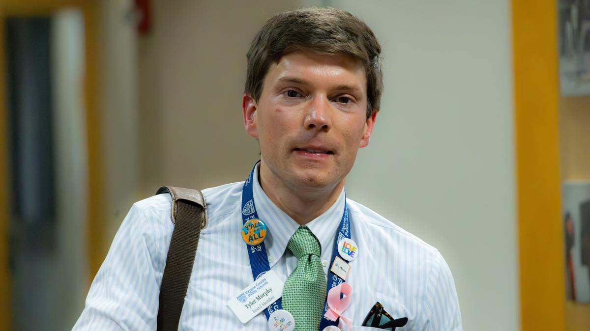 Chair of the Fayette County Board of Education, Tyler Murphy, smiles entering the Fayette County Public Schools (FCPS) board meeting room on April 16, 2026, in Lexington, Ky.