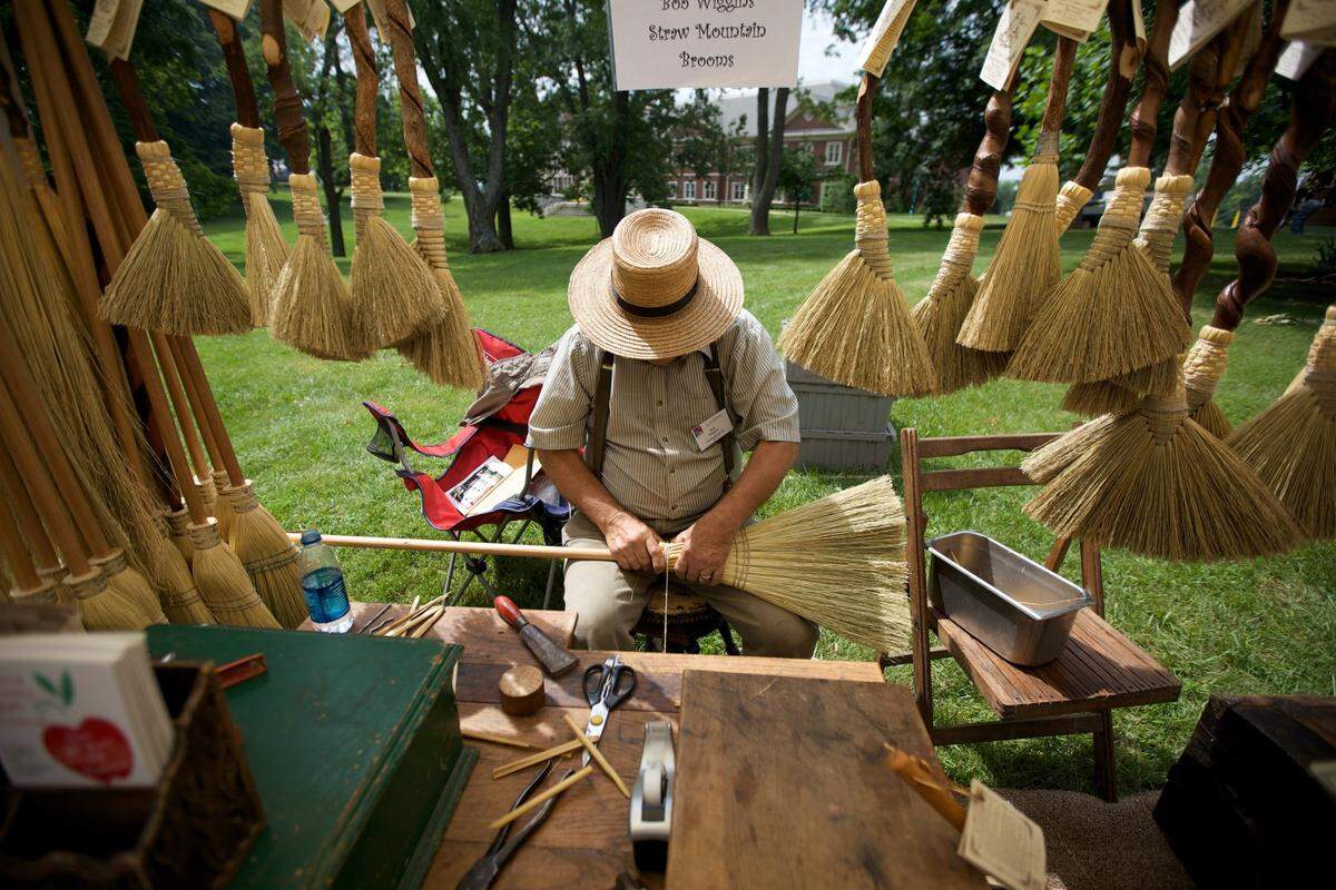 Bob Wiggins worked a new broom at the Francisco’s Farm Arts Festival in 2009. The festival is Saturday and Sunday in Midway.