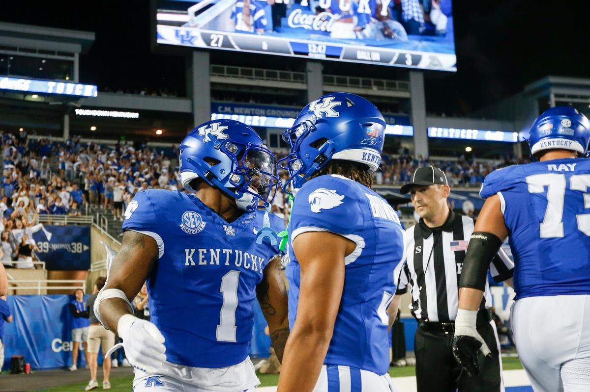 Kentucky running back Ray Davis (1) celebrates a touchdown against Akron during Saturday’s game at Kroger Field.