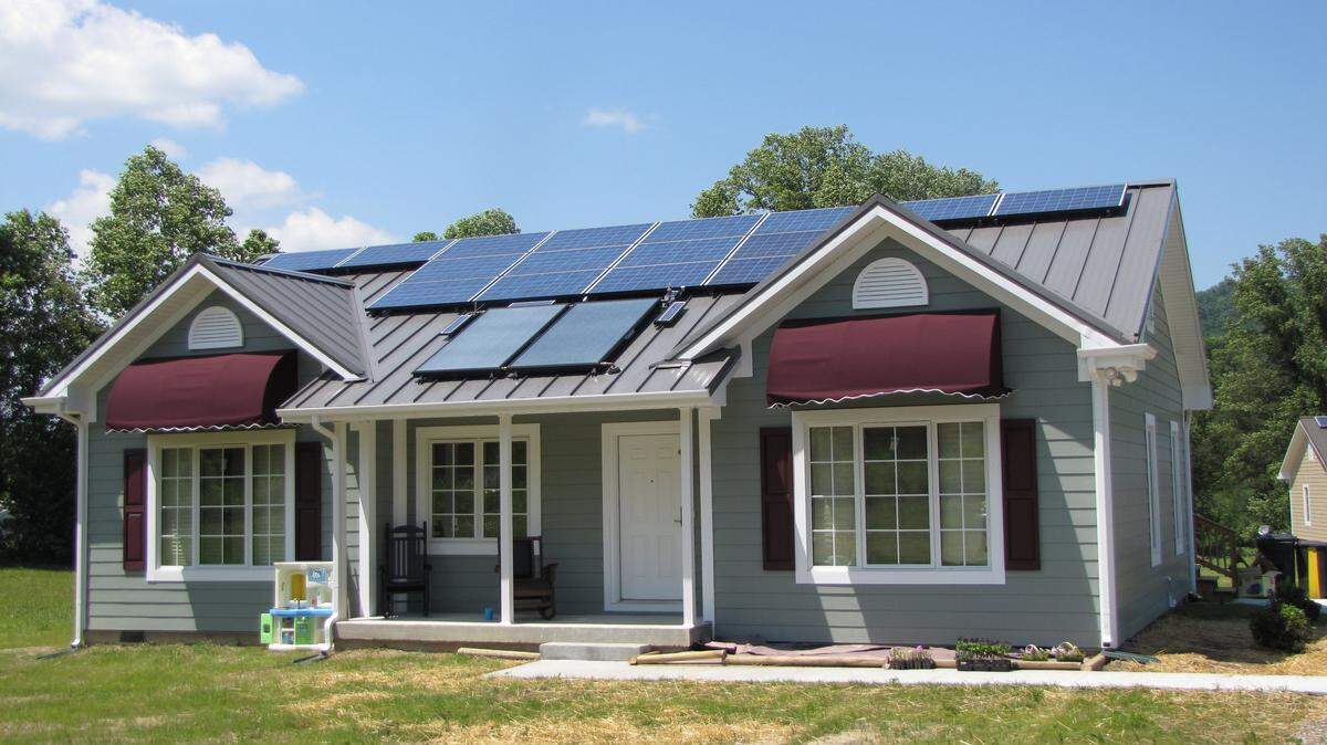 This house is one of five that an economic  development group built at Emlyn, in Whitley County, to showcase passive-house standards, which make the new structure highly energy- efficient. Much of the roof is covered with solar panels.  