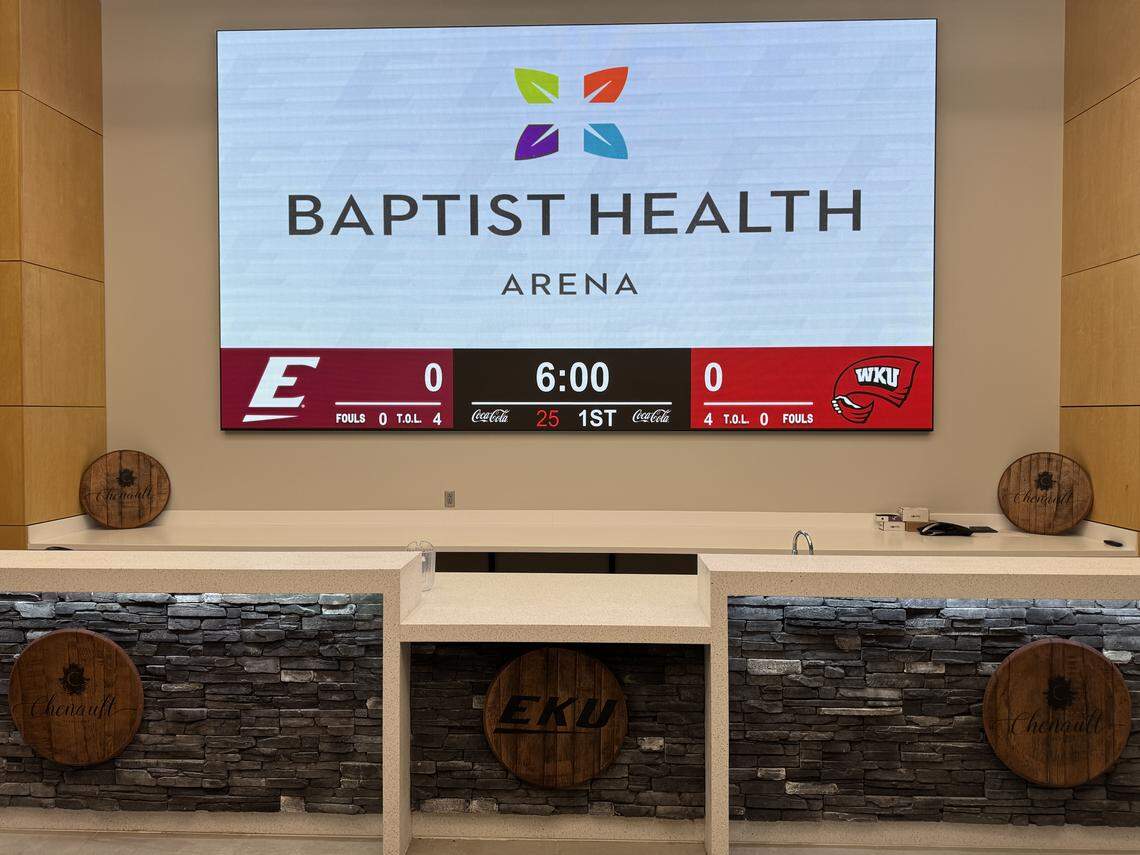 A premium seating area at Baptist Health Arena at Alumni Coliseum includes a bar with signage for Chenault Vineyards. The arena reopened Monday,